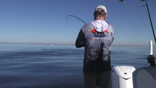 A fisherman standing in a boat Tampa Bay Snapper Fishing