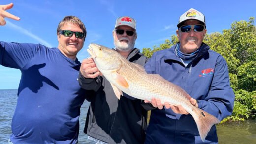 Captain Sergio Atanes, Ron and Michael Dawson with a big Tarpon Springs redfish